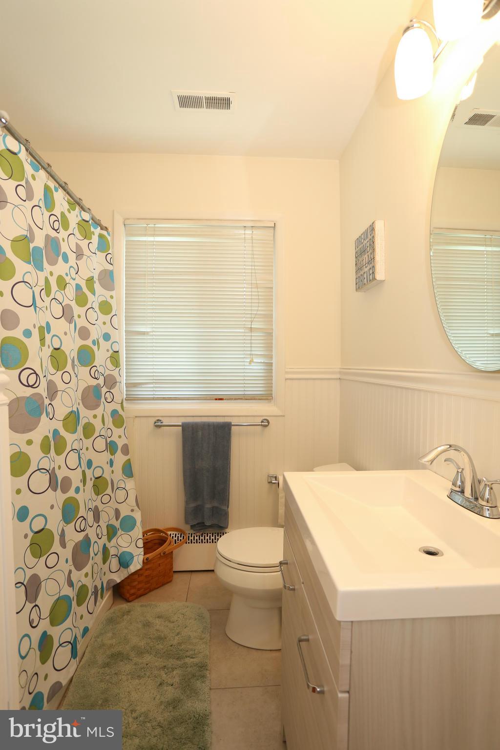4013 High Point Road Ellicott City, MD 21042 - Photo 22 of 30 a bathroom with a sink toilet and shower