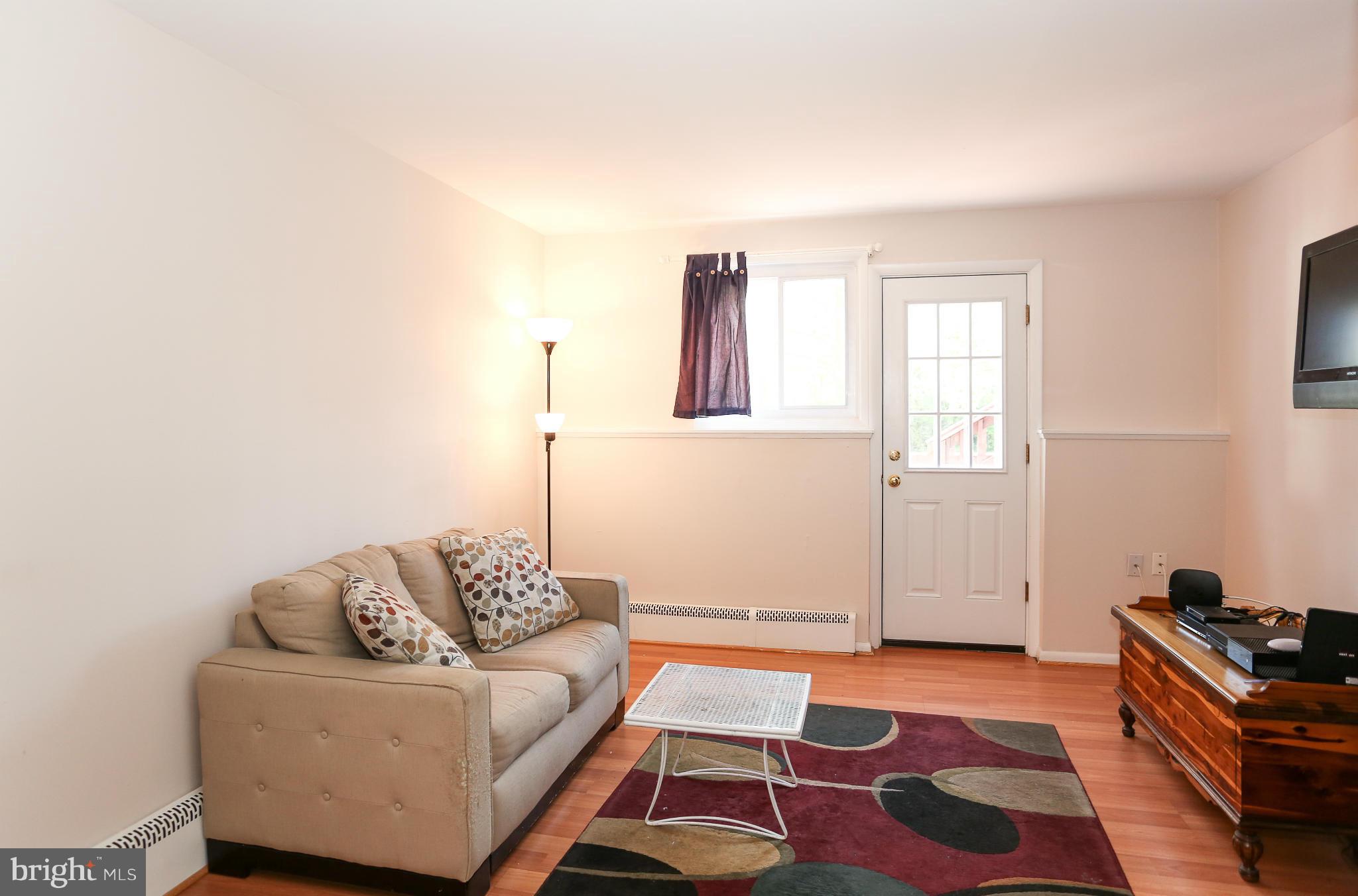 4013 High Point Road Ellicott City, MD 21042 - Photo 25 of 30 a living room with furniture and a rug