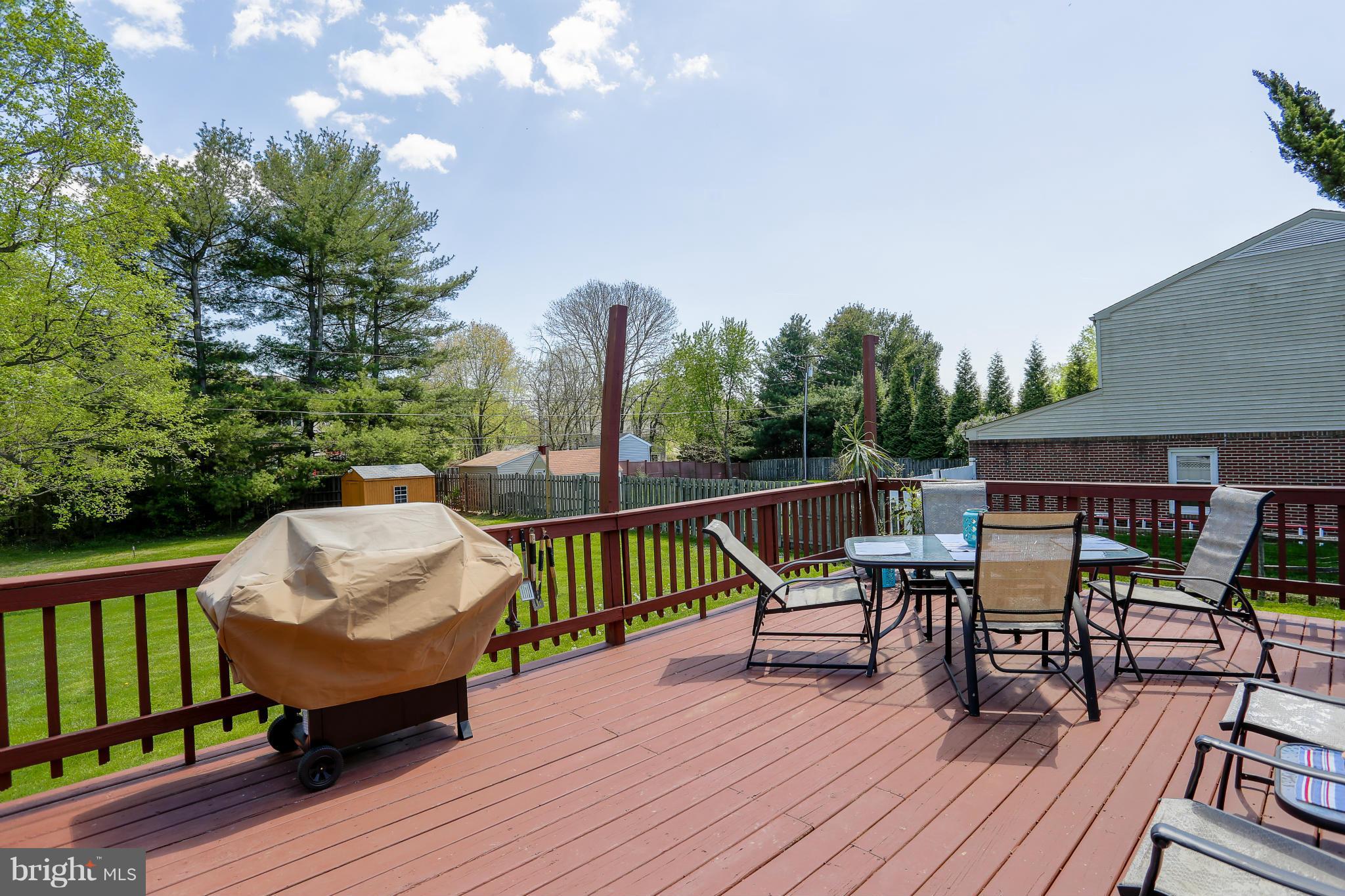 4013 High Point Road Ellicott City, MD 21042 - Photo 27 of 30 a view of a deck with furniture and a garden