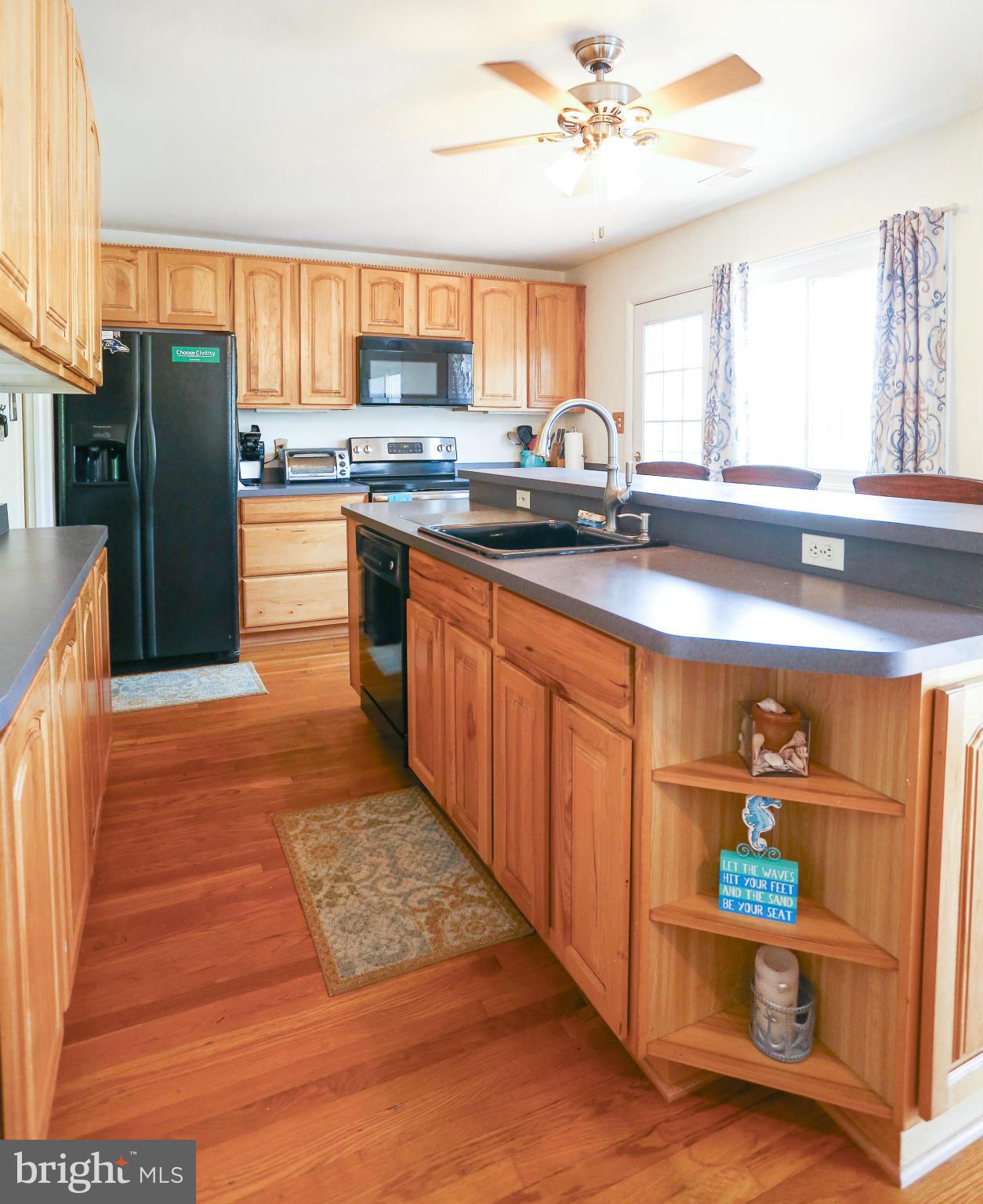 4013 High Point Road Ellicott City, MD 21042 - Photo 4 of 30 a kitchen with stainless steel appliances granite countertop a refrigerator and a sink