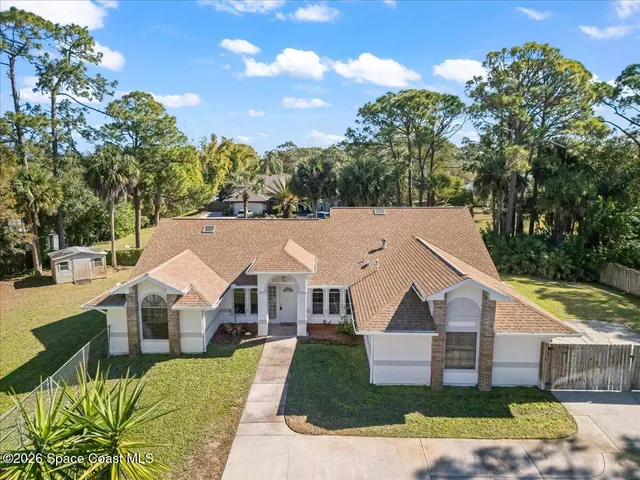 a aerial view of a house with a yard