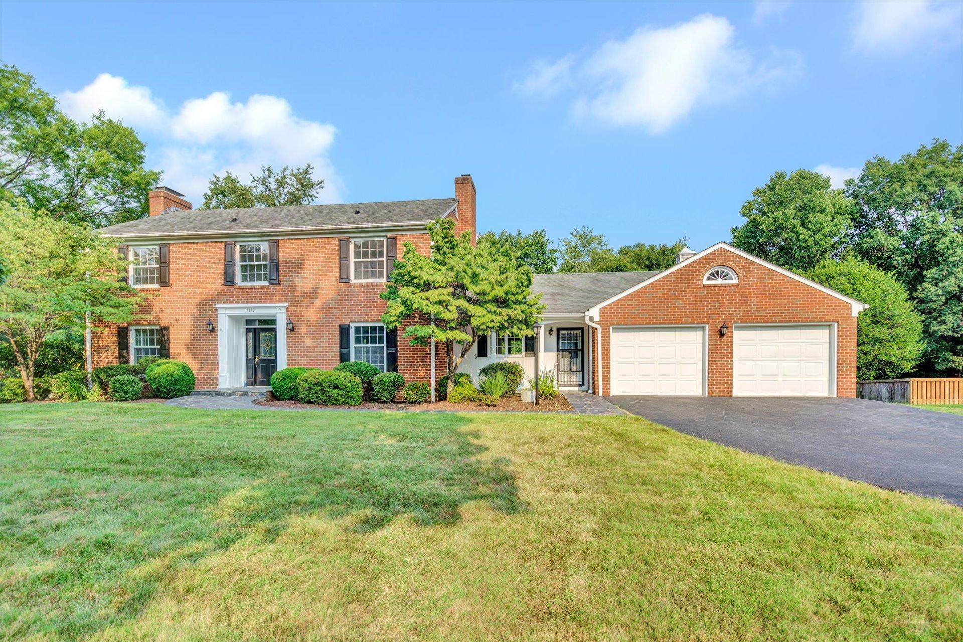 5157 Falcon Ridge Road Roanoke, VA 24018 - Photo 2 of 50 a front view of a house with a yard and garage