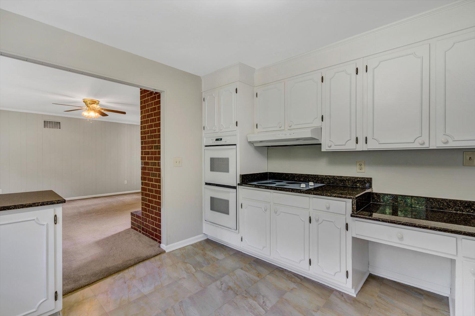 5157 Falcon Ridge Road Roanoke, VA 24018 - Photo 20 of 50 a kitchen with granite countertop white cabinets and stainless steel appliances