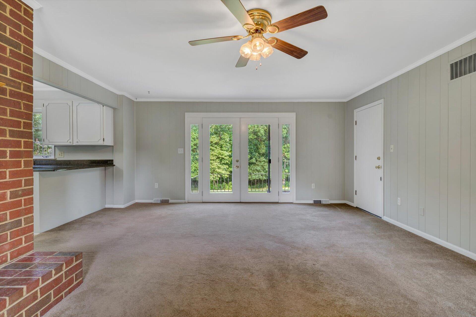 5157 Falcon Ridge Road Roanoke, VA 24018 - Photo 23 of 50 a view of a kitchen with a ceiling fan and a large window