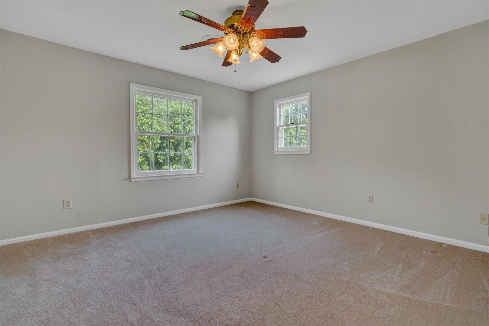 5157 Falcon Ridge Road Roanoke, VA 24018 - Photo 30 of 50 an empty room with windows and fan