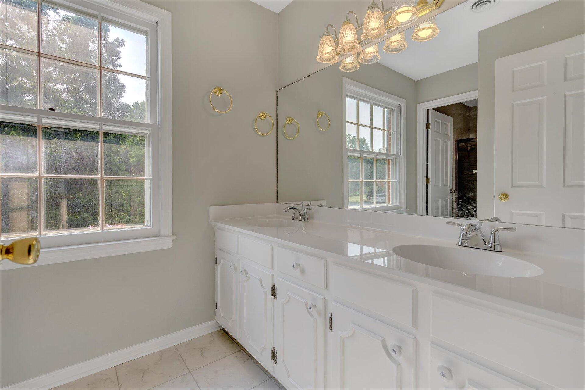 5157 Falcon Ridge Road Roanoke, VA 24018 - Photo 31 of 50 a bathroom with double vanity and a mirror