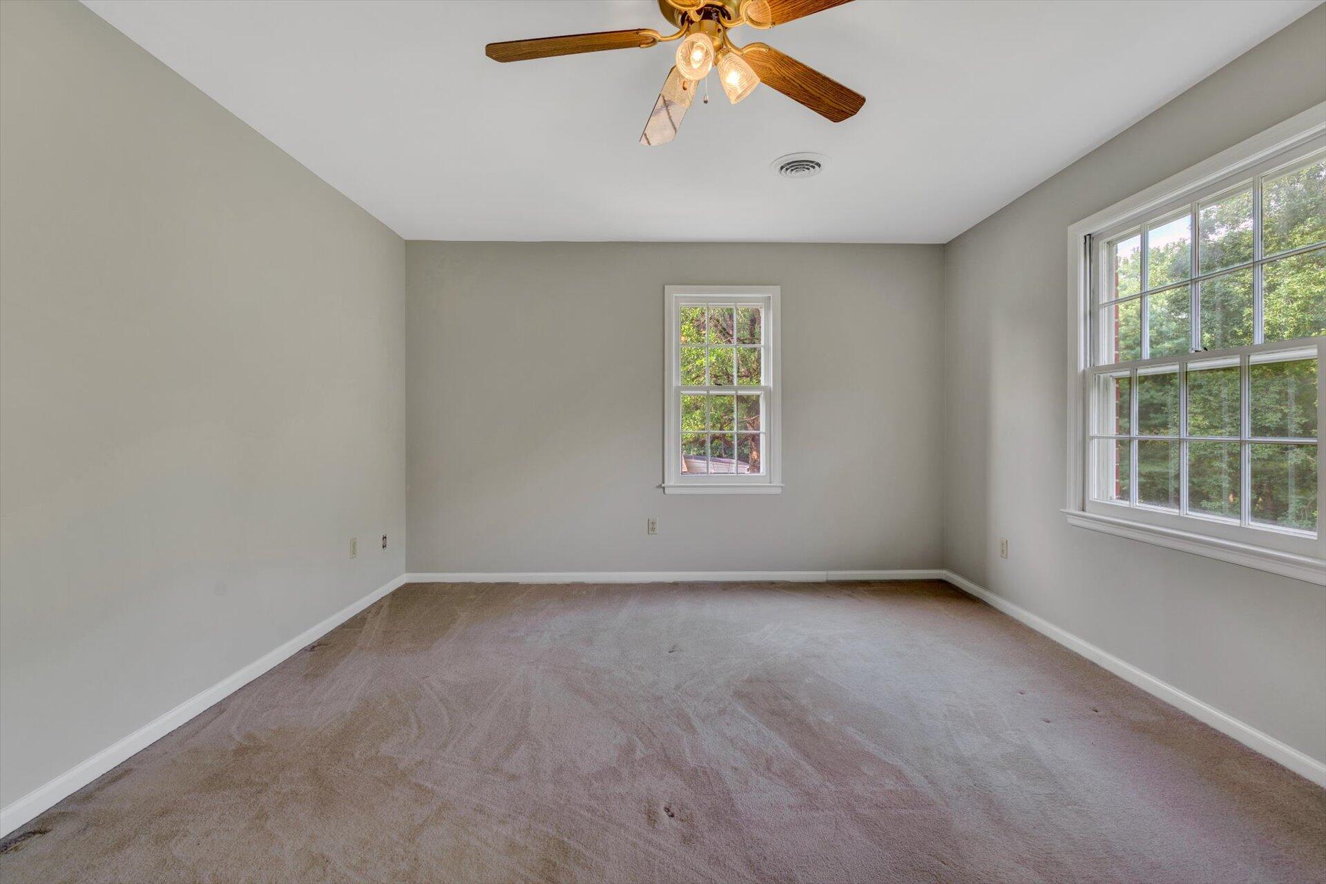 5157 Falcon Ridge Road Roanoke, VA 24018 - Photo 35 of 50 an empty room with windows and fan