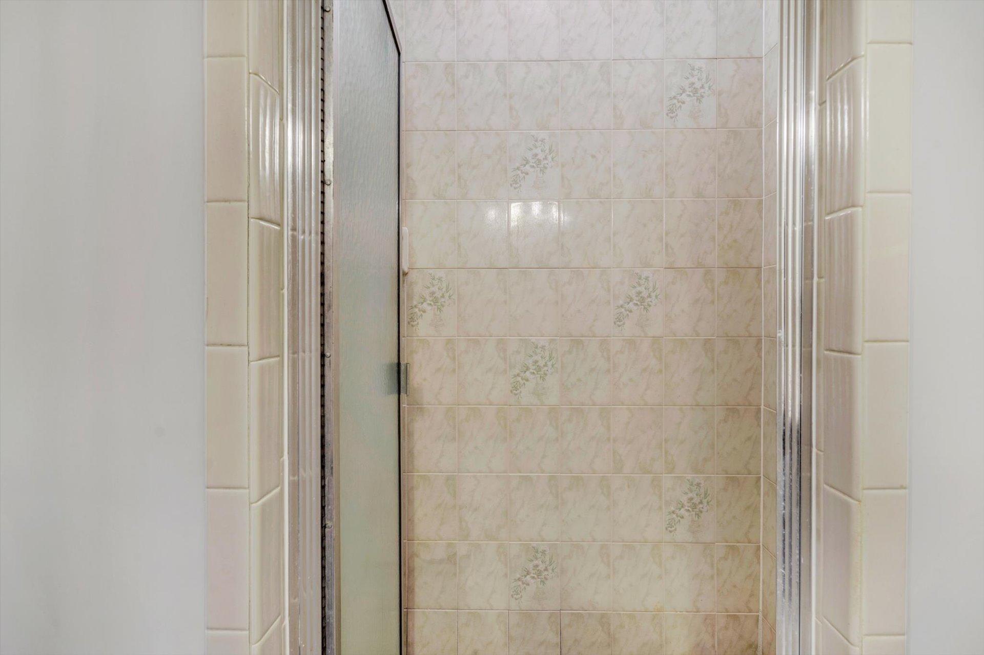 5157 Falcon Ridge Road Roanoke, VA 24018 - Photo 39 of 50 a bathroom with a glass shower door