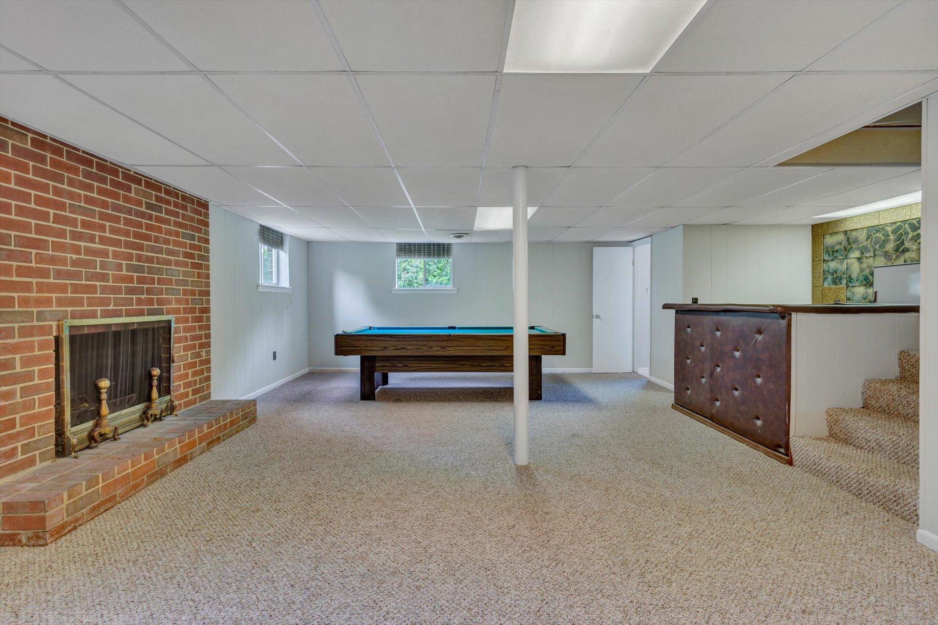 5157 Falcon Ridge Road Roanoke, VA 24018 - Photo 40 of 50 a view of an empty room with furniture and a fireplace