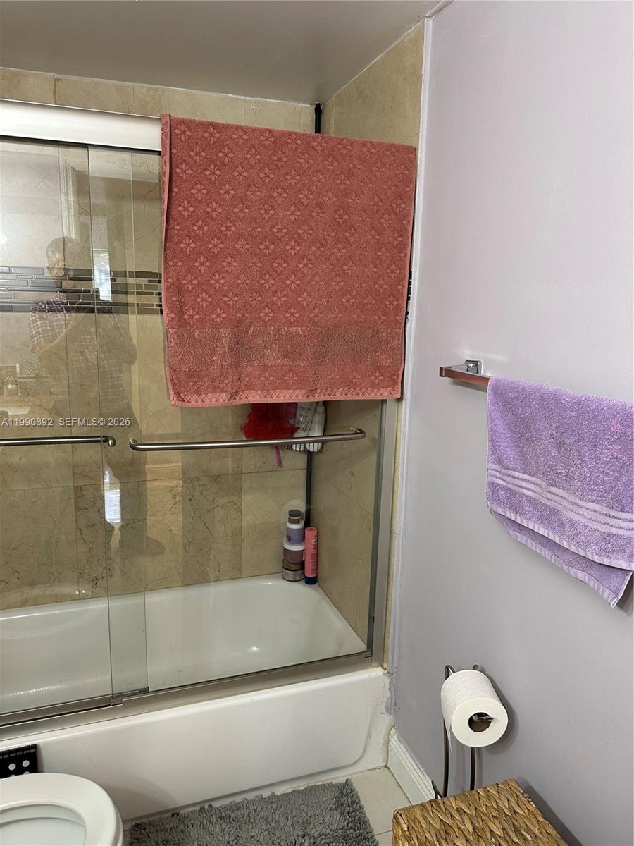 13810 Southwest 112th Street, Unit 106 Miami, FL 33186 - Photo 14 of 20 a bathroom with a sink and a toilet