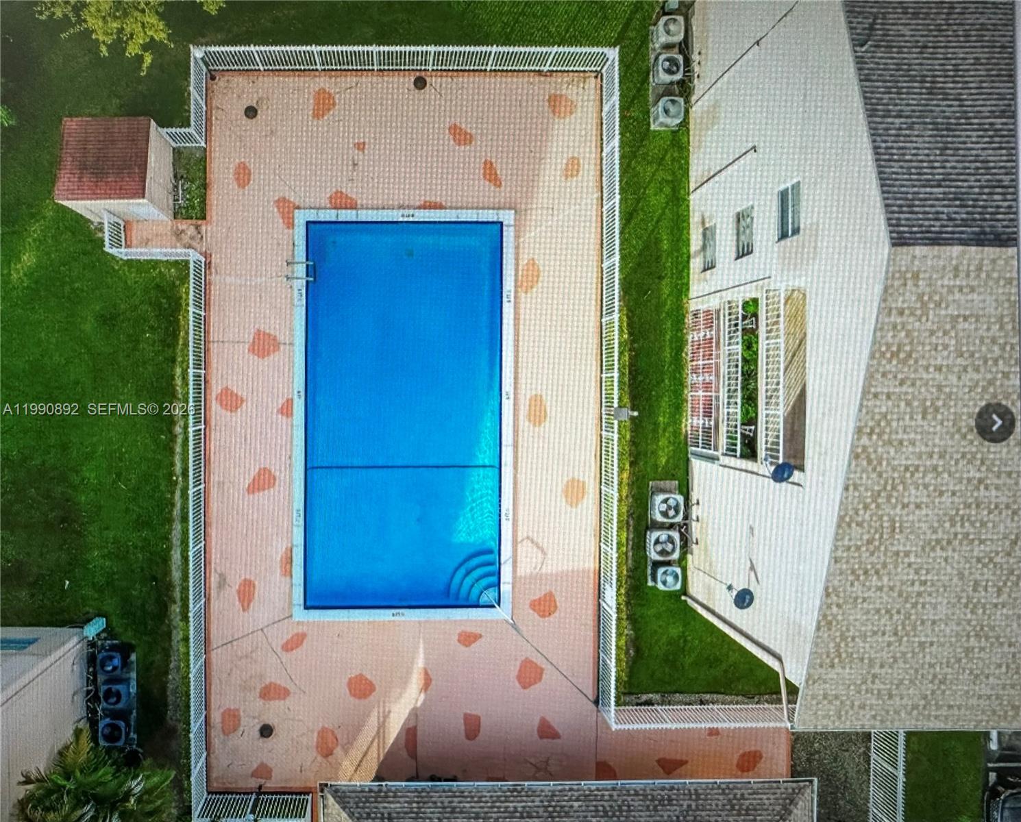 13810 Southwest 112th Street, Unit 106 Miami, FL 33186 - Photo 15 of 20 an aerial view of a house with a yard