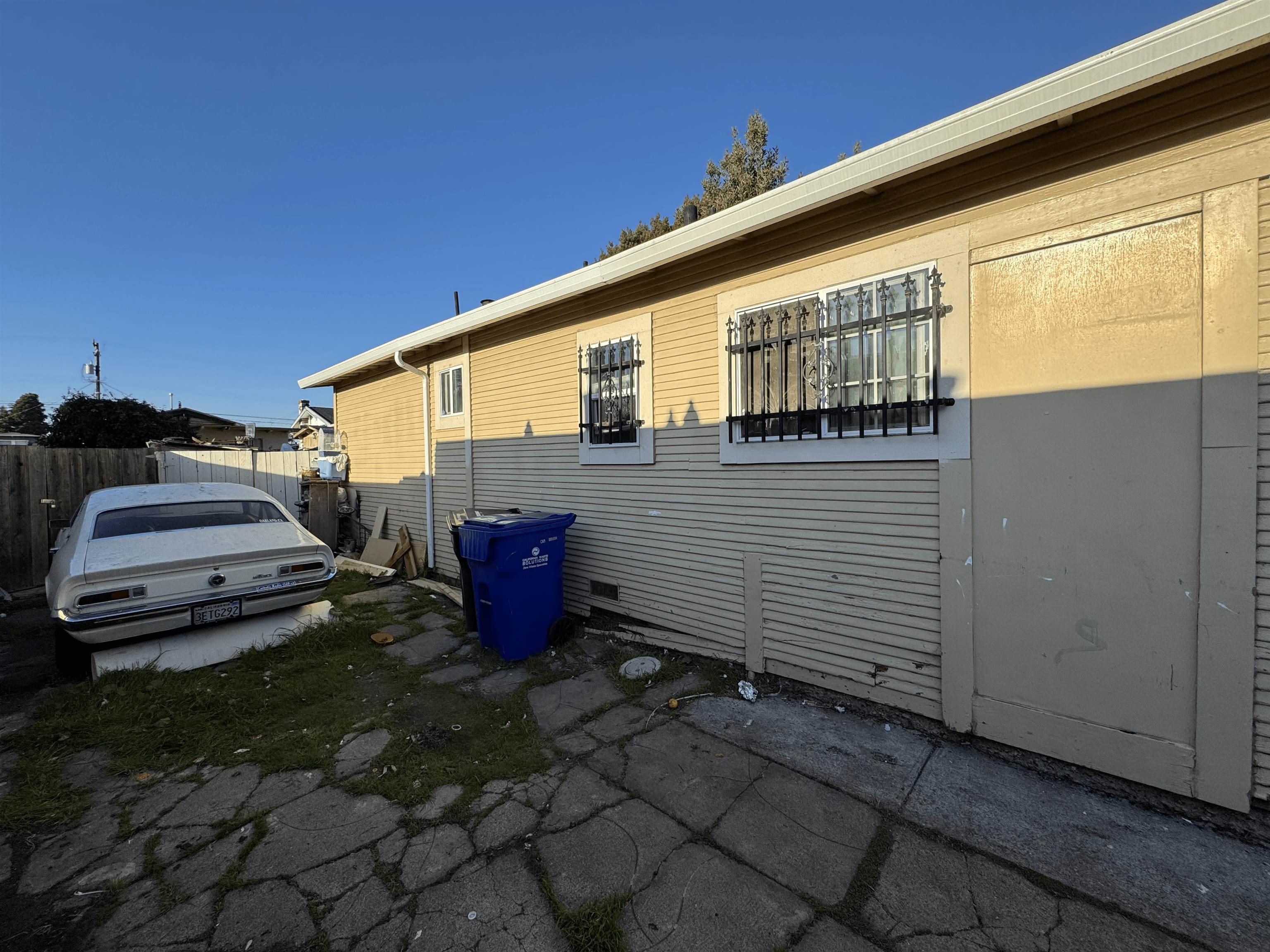 1823 Church Street Oakland, CA 94621 - Photo 12 of 15 a backyard of a house with barbeque oven and outdoor seating