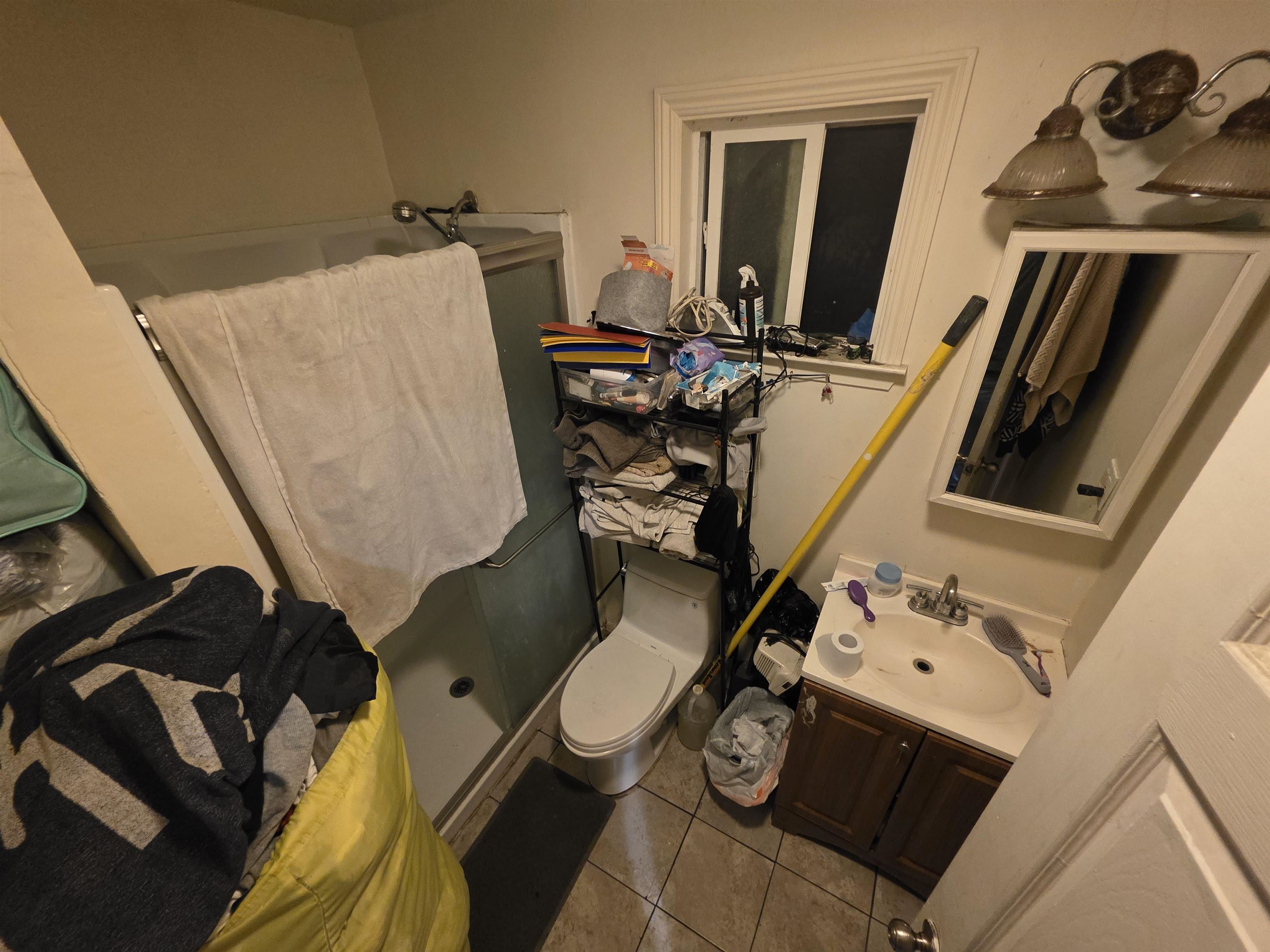 1823 Church Street Oakland, CA 94621 - Photo 6 of 15 walk in closet with wooden floor washer and dryer