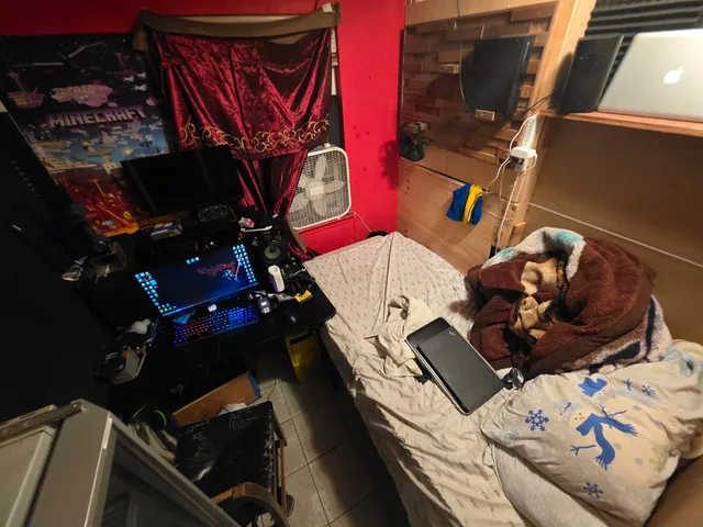 a backyard of a house with barbeque oven and outdoor seating