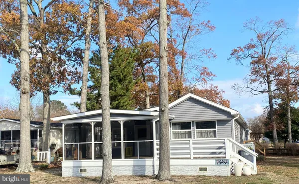 a house with a tree in front of it