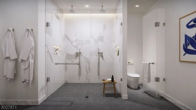 a view of a bathroom with shower and toilet
