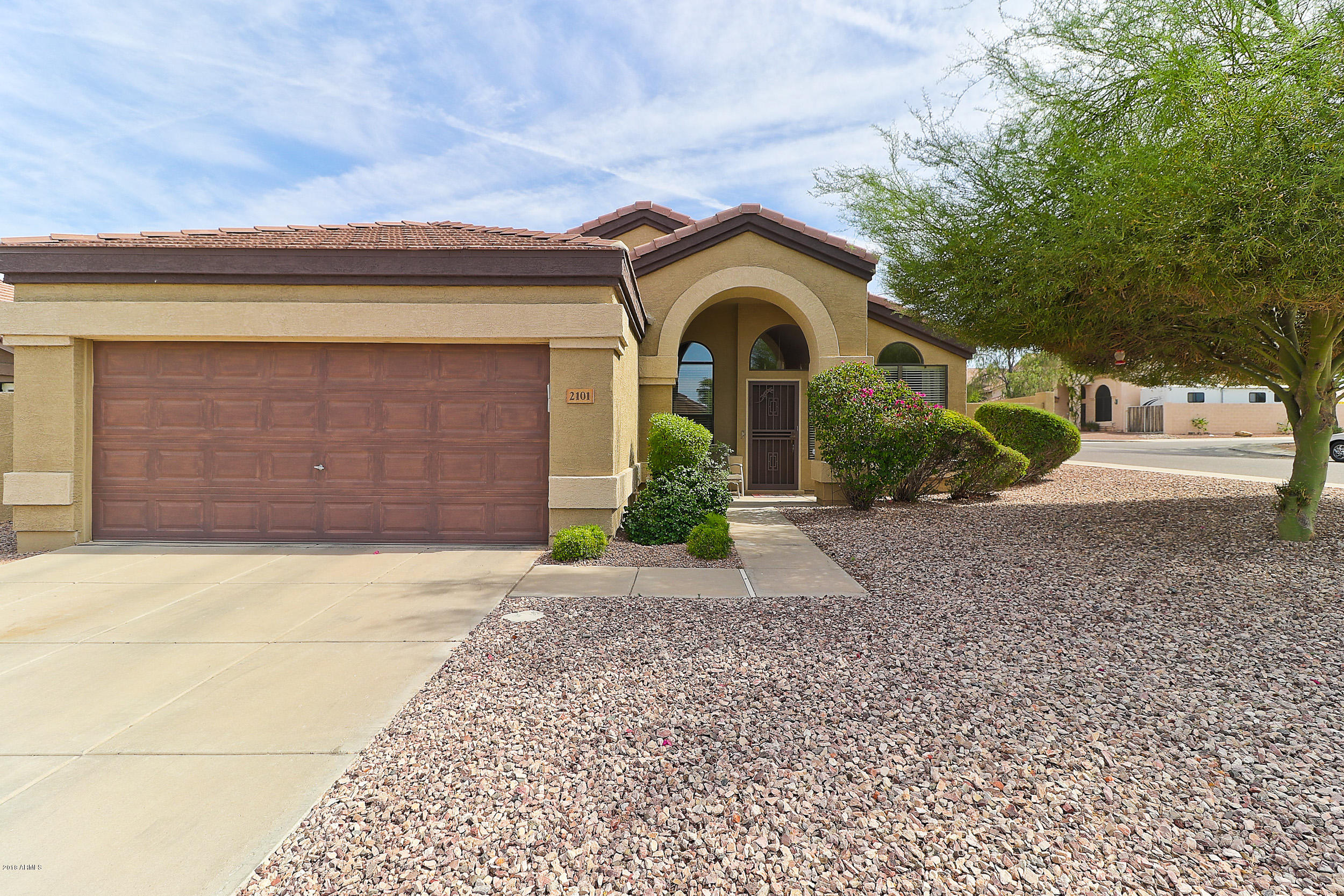 2101 East Escuda Road Phoenix, AZ 85024 - Photo 1 of 31 a front view of a house with garden