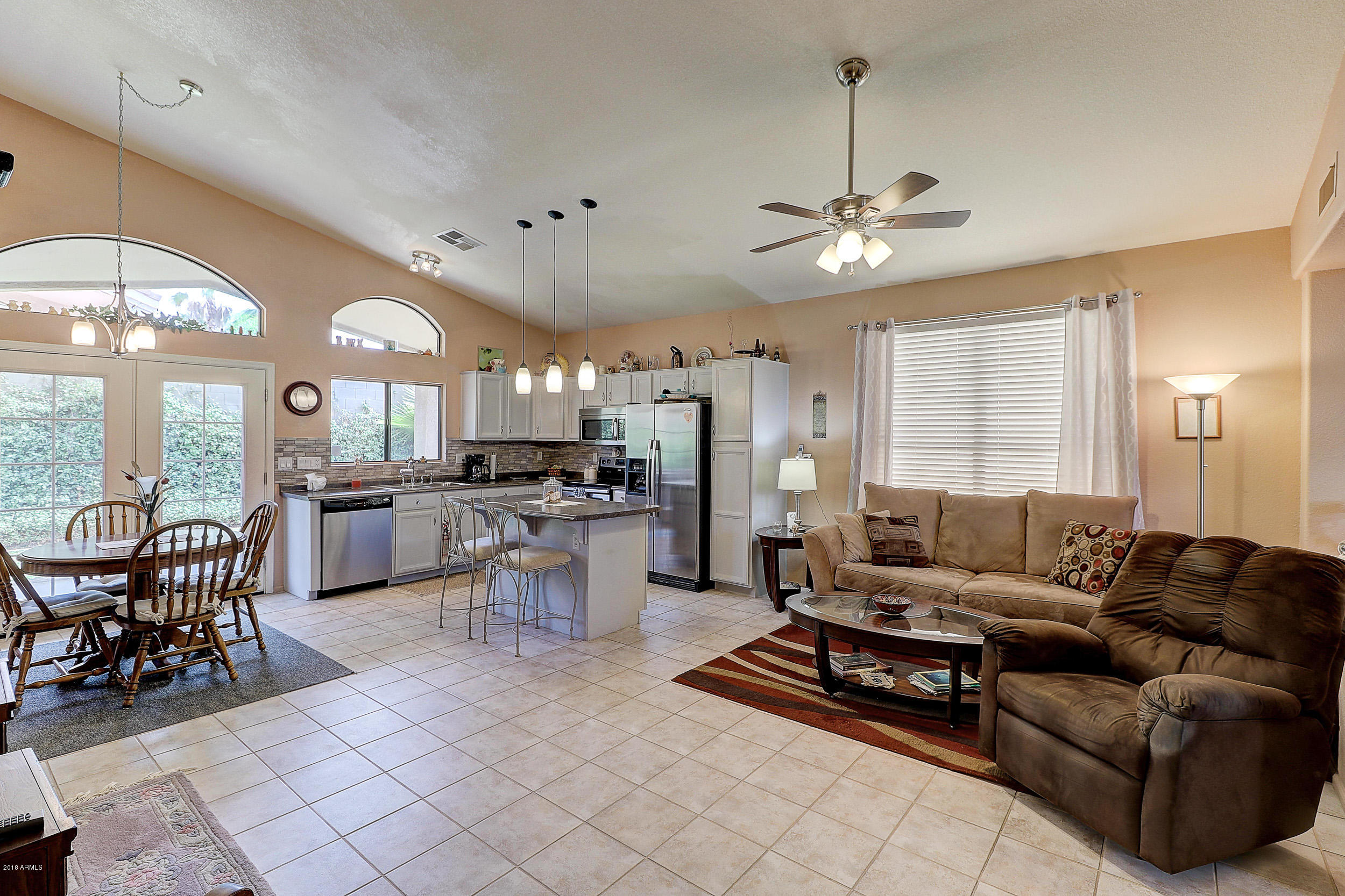 2101 East Escuda Road Phoenix, AZ 85024 - Photo 11 of 31 a living room with furniture a dining table and chairs