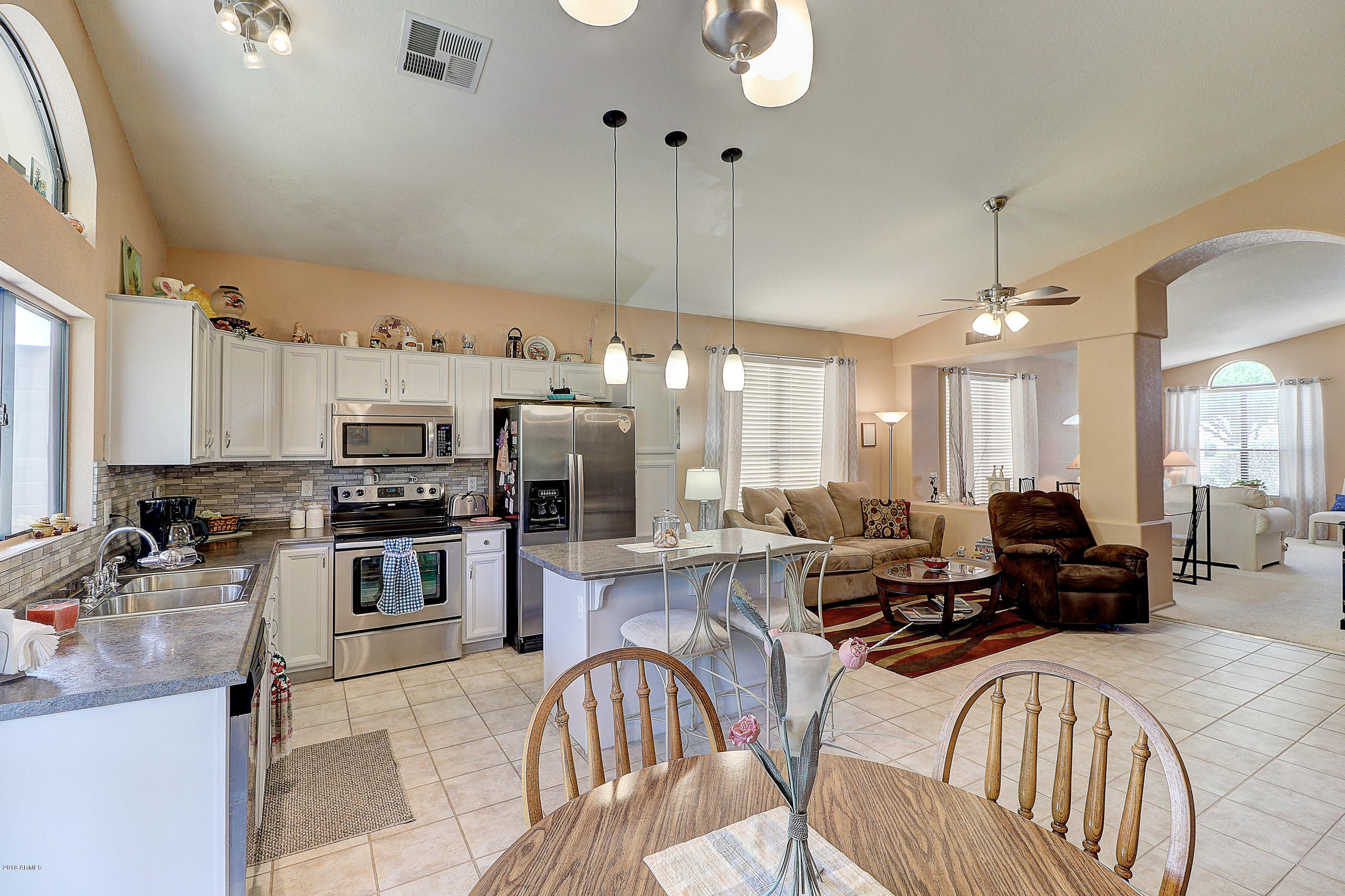 2101 East Escuda Road Phoenix, AZ 85024 - Photo 12 of 31 a large kitchen with a large counter top appliances and cabinets