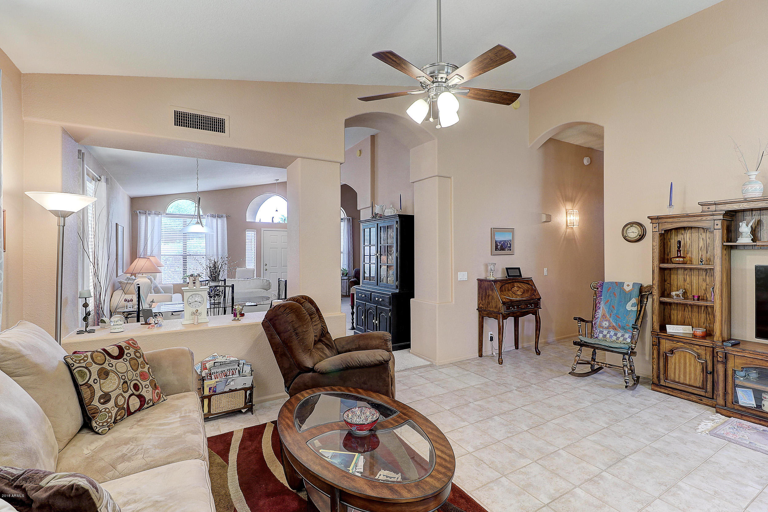 2101 East Escuda Road Phoenix, AZ 85024 - Photo 13 of 31 a living room with furniture a dining table and chairs