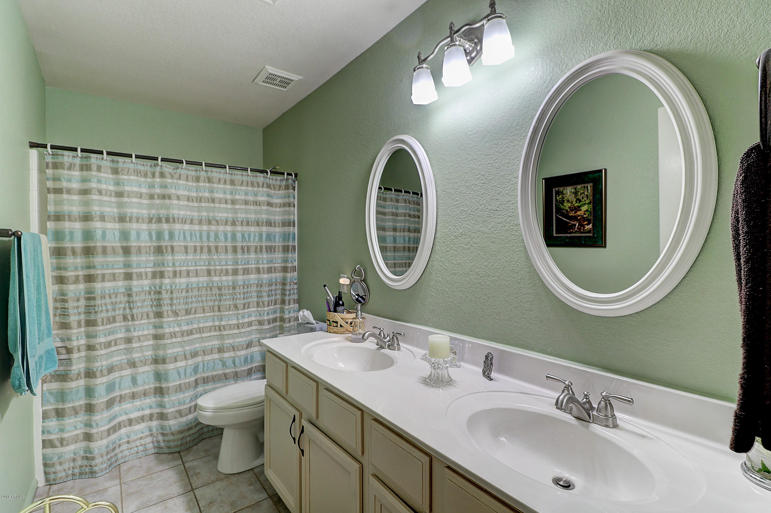 2101 East Escuda Road Phoenix, AZ 85024 - Photo 15 of 31 a bathroom with a double vanity sink mirror and toilet
