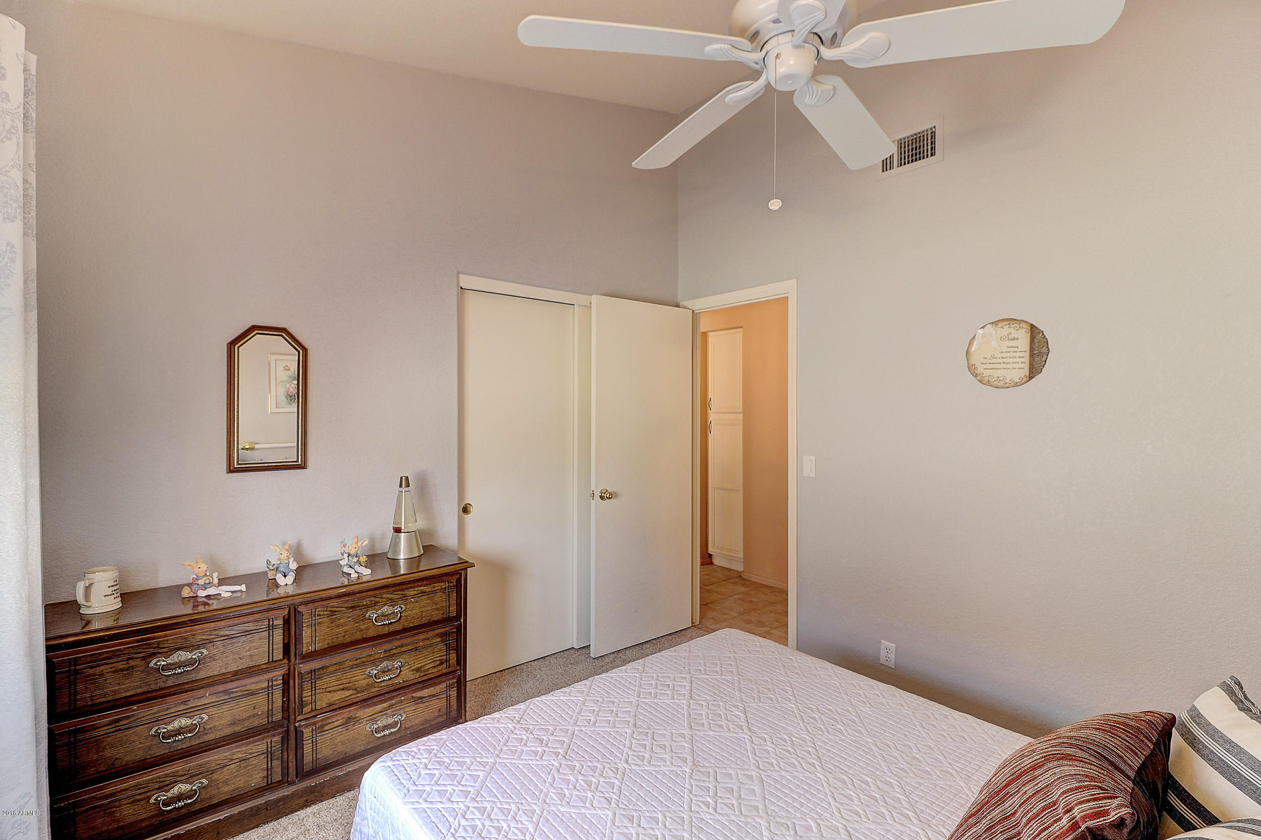 2101 East Escuda Road Phoenix, AZ 85024 - Photo 19 of 31 a bedroom with a bed and a dresser