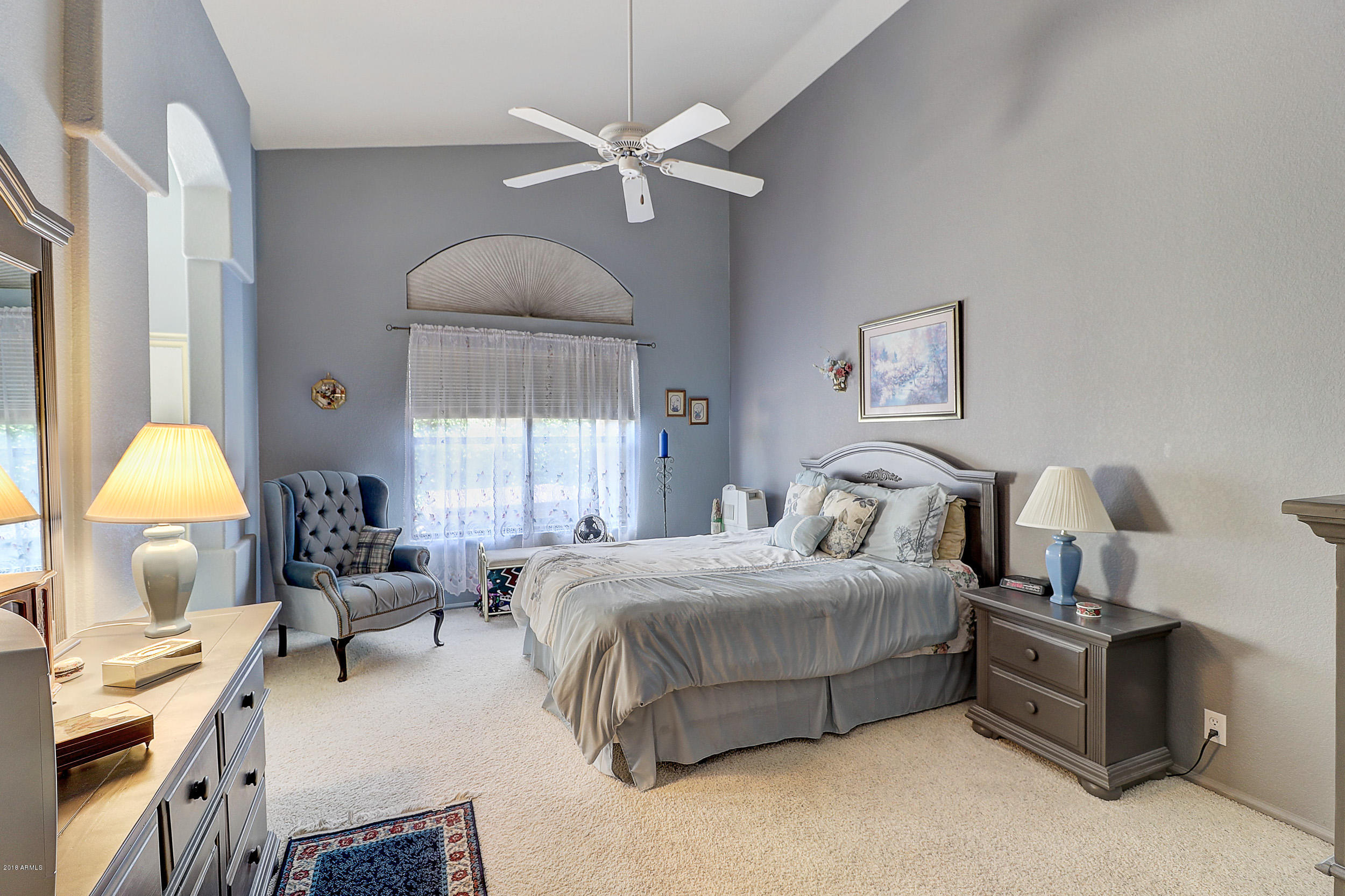 2101 East Escuda Road Phoenix, AZ 85024 - Photo 21 of 31 a bedroom with bed a chandelier and a window