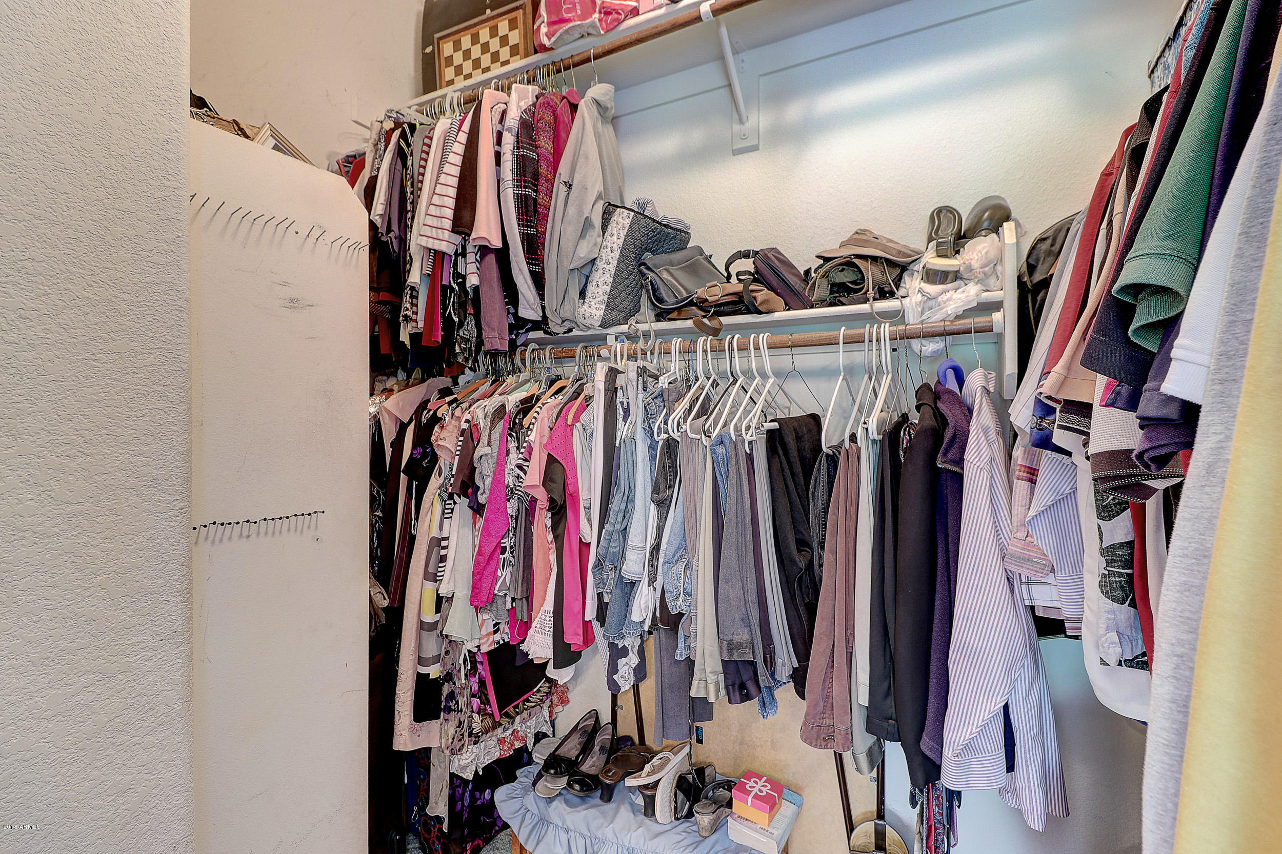 2101 East Escuda Road Phoenix, AZ 85024 - Photo 25 of 31 a view of walk in closet with clothes