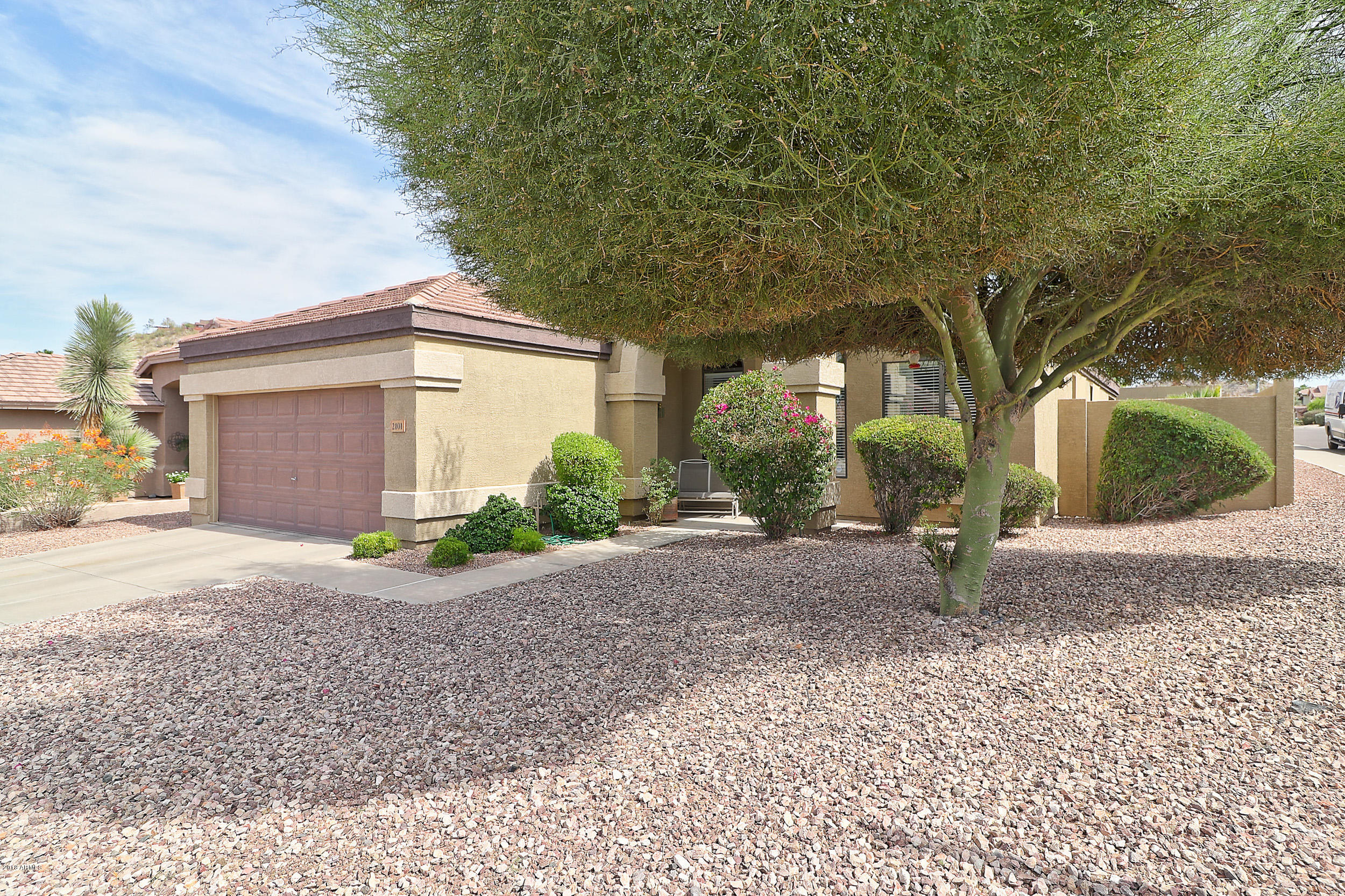2101 East Escuda Road Phoenix, AZ 85024 - Photo 5 of 31 a front view of a house with a yard and garage