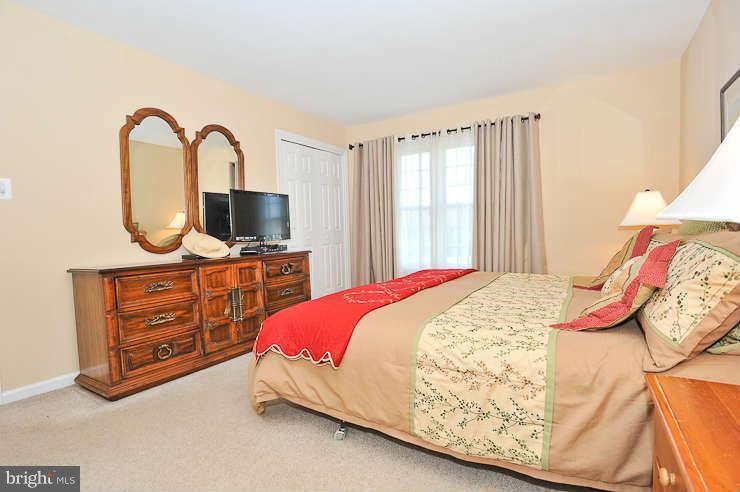 8901 Spur Road Springfield, VA 22153 - Photo 14 of 30 a bedroom with a bed and dresser