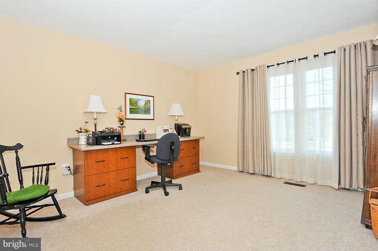 8901 Spur Road Springfield, VA 22153 - Photo 16 of 30 a view of a workspace with furniture and a window