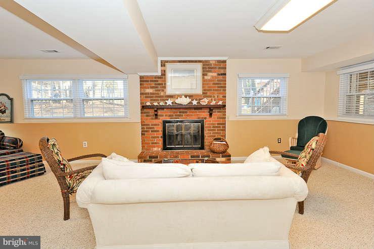 8901 Spur Road Springfield, VA 22153 - Photo 21 of 30 a living room with furniture and a fireplace