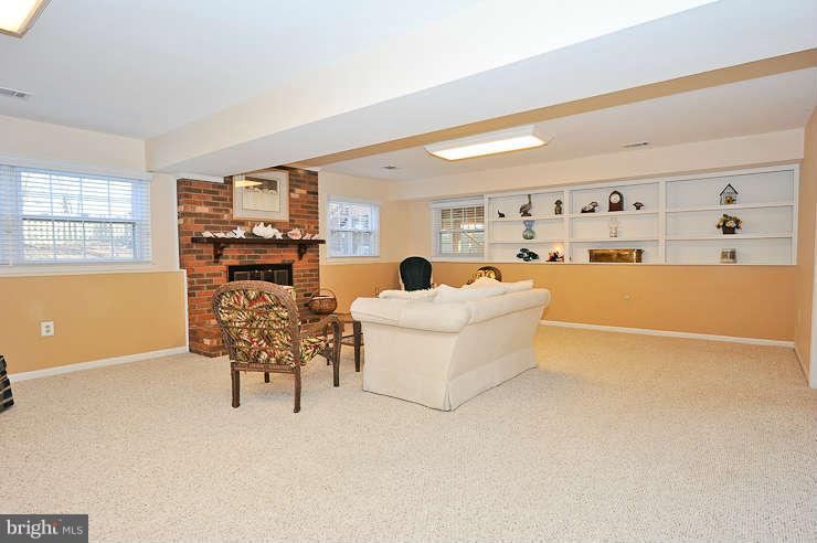 8901 Spur Road Springfield, VA 22153 - Photo 22 of 30 a living room with furniture and chandelier