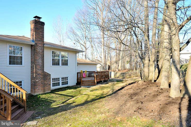8901 Spur Road Springfield, VA 22153 - Photo 29 of 30 a view of backyard with a large tree