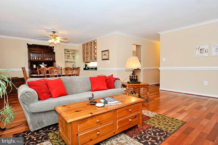 8901 Spur Road Springfield, VA 22153 - Photo 6 of 30 a living room with furniture a dining table and a lamp