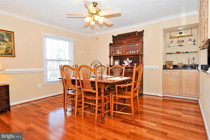 8901 Spur Road Springfield, VA 22153 - Photo 7 of 30 a dining room with furniture and wooden floor