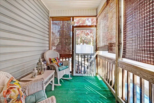 a balcony with furniture and garden