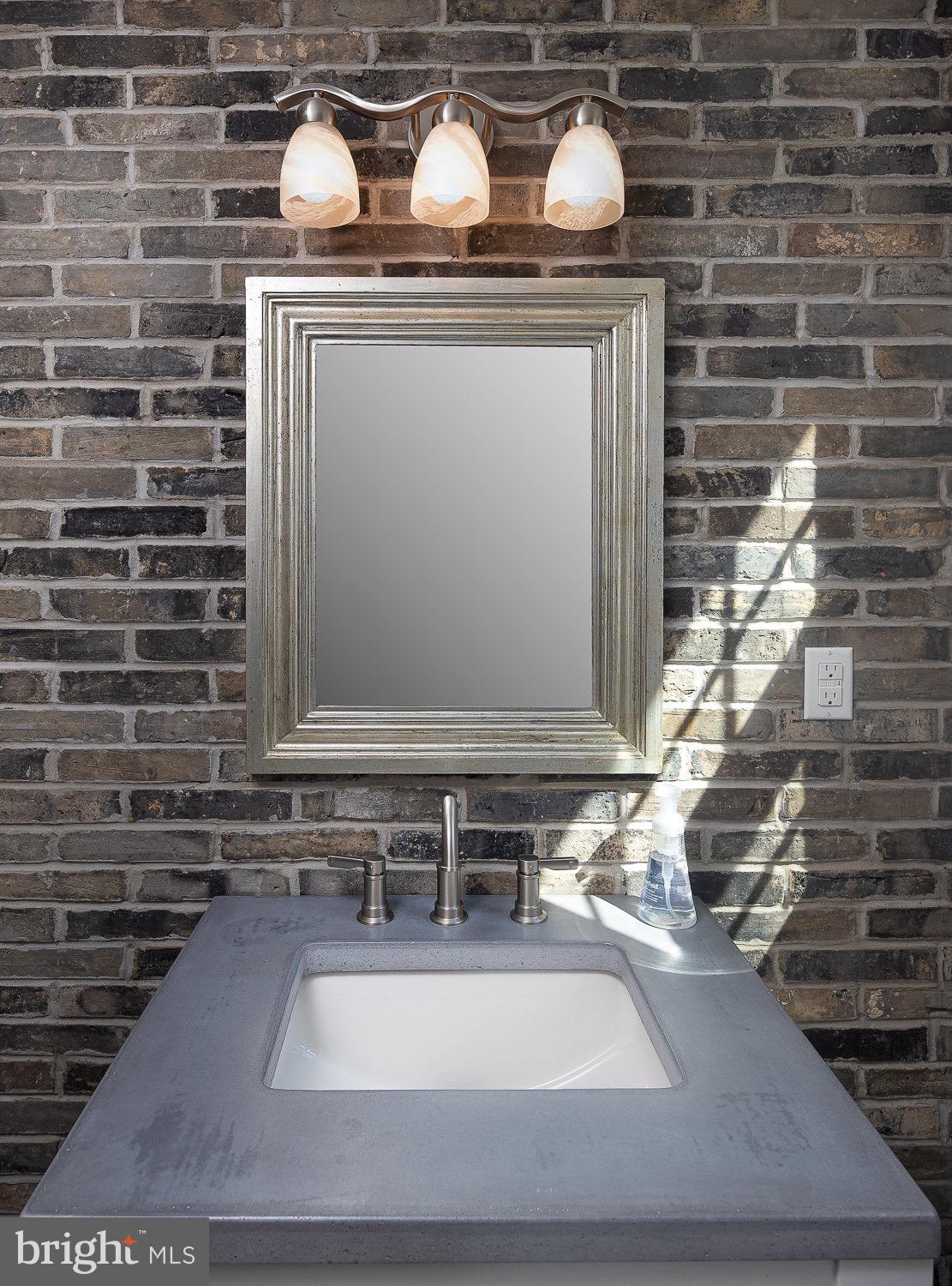2 Chatham Place Wallingford, PA 19086 - Photo 17 of 37 Loft-style brick powder room detail