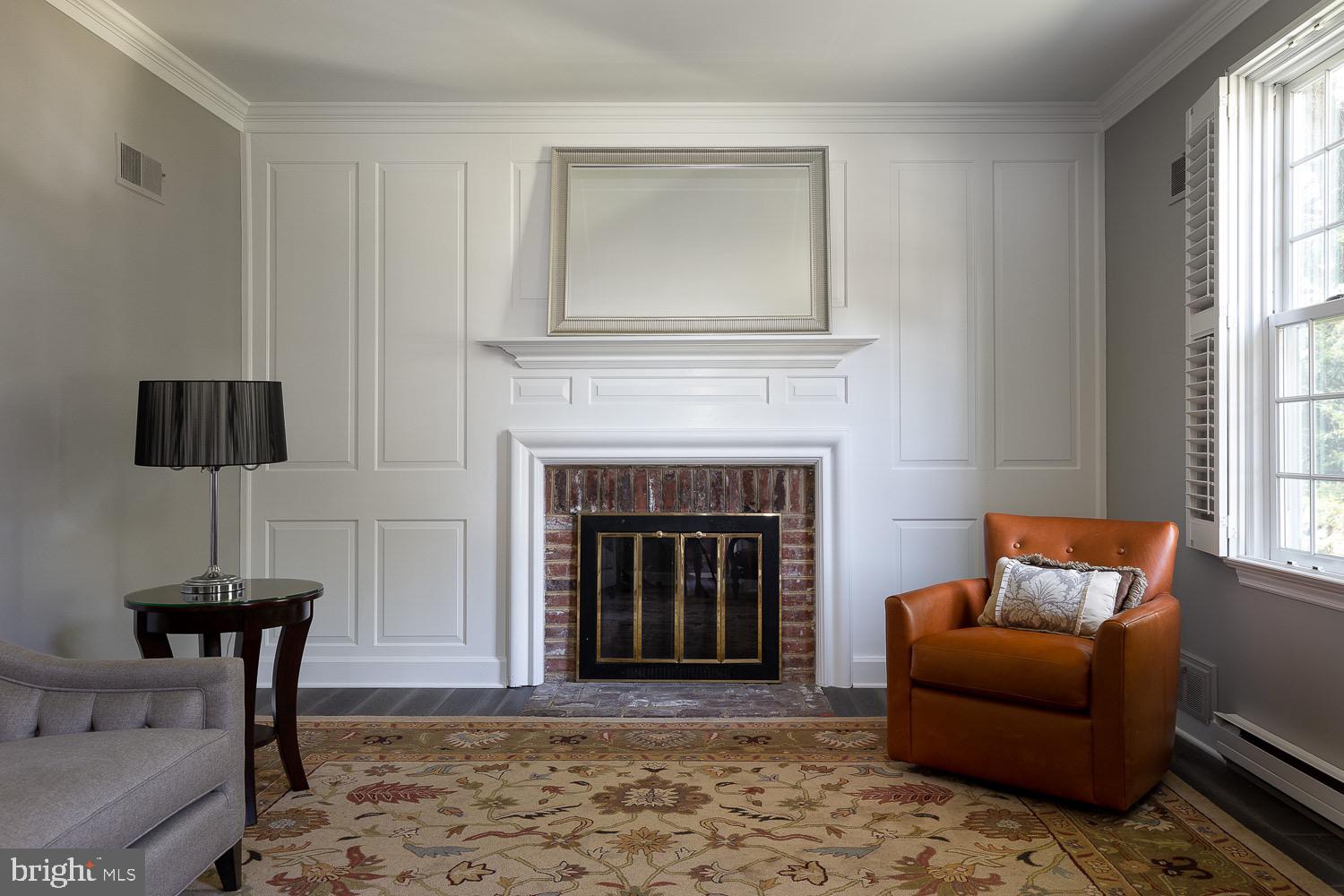 2 Chatham Place Wallingford, PA 19086 - Photo 4 of 37 Fireplace set in a wall of wainscoting
