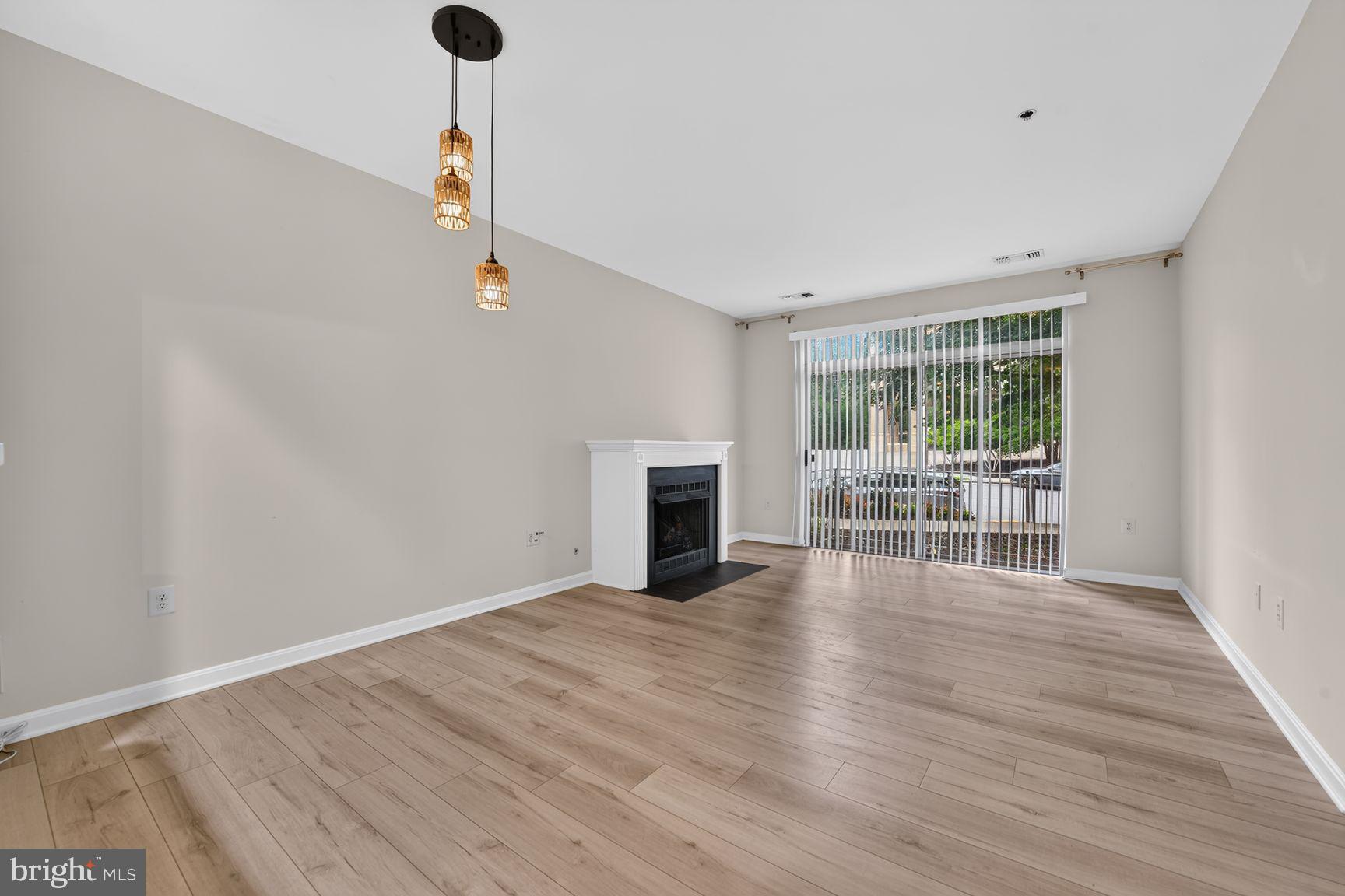 11775 Stratford House Place, Unit 112 Reston, VA 20190 - Photo 15 of 53 Living Room & Dining Area