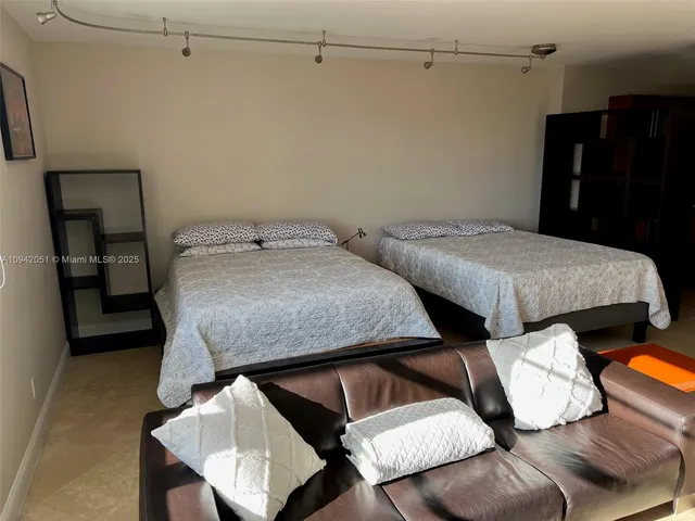 a room with furniture and a flat screen tv