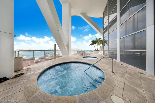 a view of a swimming pool with a patio