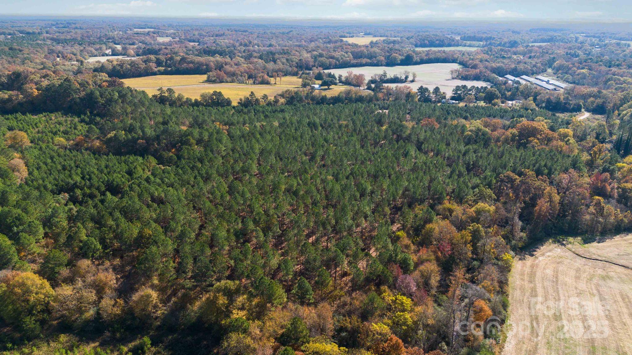 Tbd Deep Springs Road Marshville, NC 28103 - Photo 9 of 12 an aerial view of residential houses with outdoor space and trees