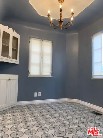 a view of a room with furniture and window