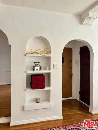 a view of living room with hallway and dresser