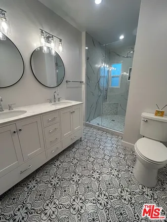 a bathroom with a shower and a sink