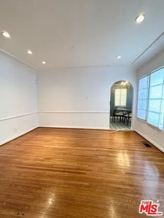 a view of a chandelier fan and a rug