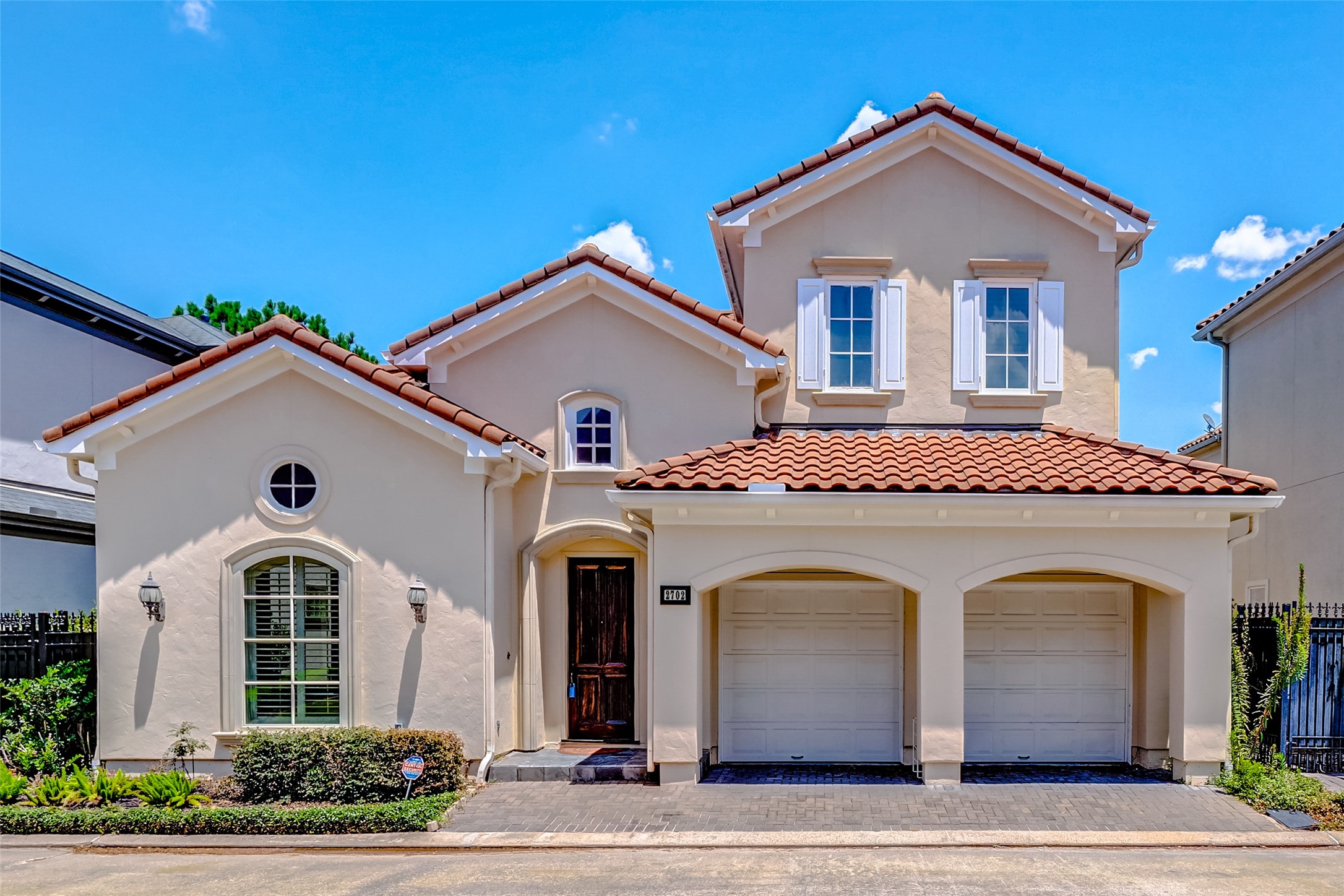 2702 Tudor Manor Houston, TX 77082 - Photo 1 of 25 a front view of a house with a yard