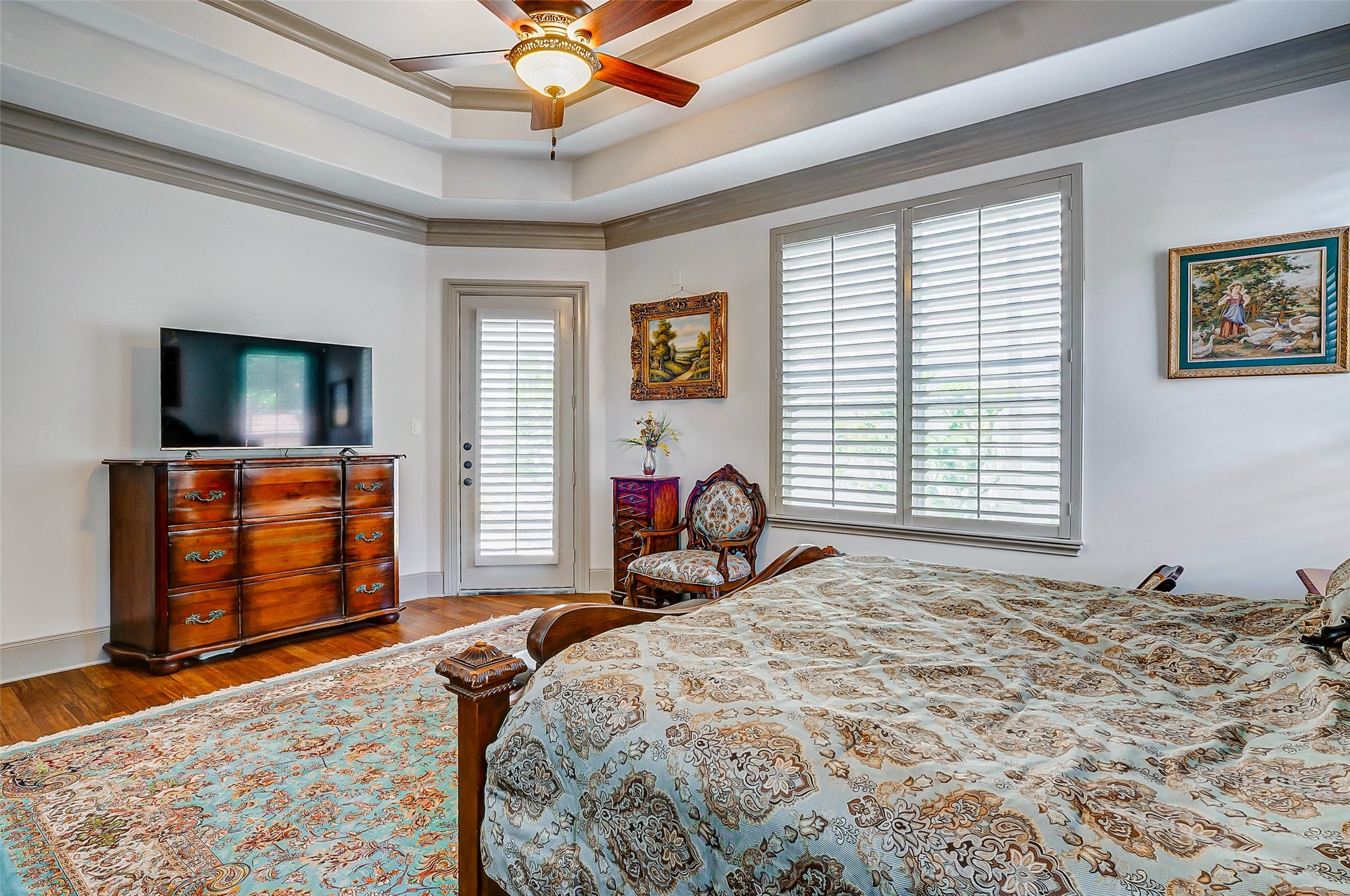 2702 Tudor Manor Houston, TX 77082 - Photo 12 of 25 a bedroom with a bed and a flat screen tv