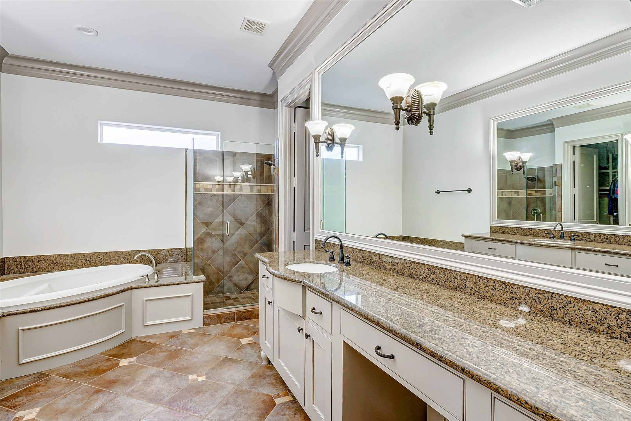 2702 Tudor Manor Houston, TX 77082 - Photo 14 of 25 a spacious bathroom with a granite countertop sink a large mirror and a